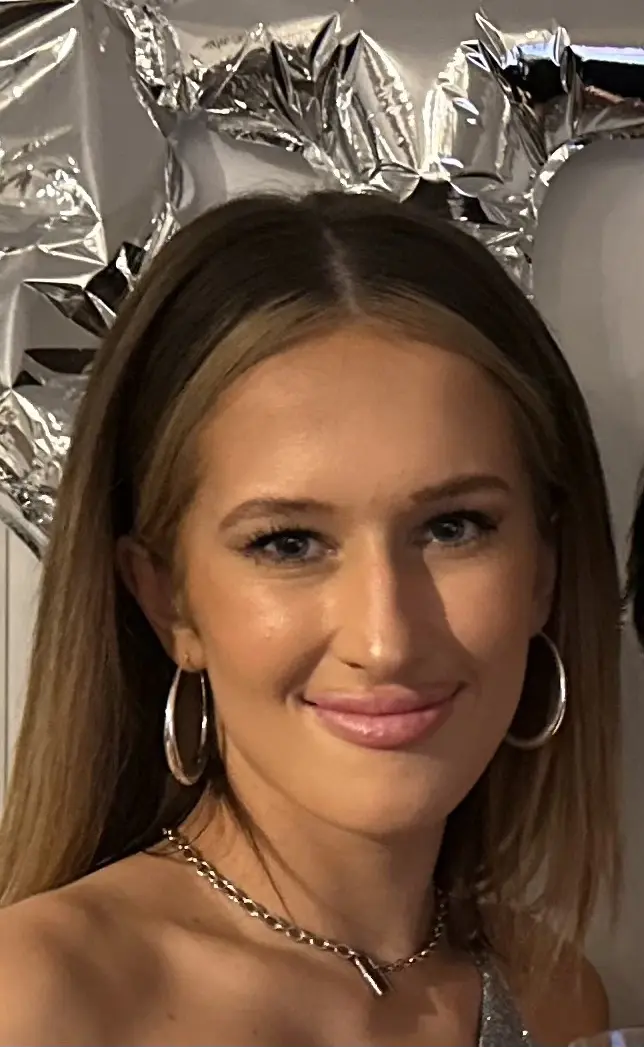 A woman wearing hoop earrings